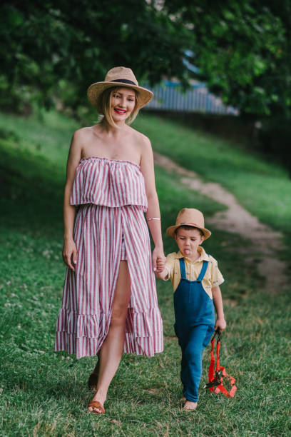istock Mother and son walking in the nature 1323932730