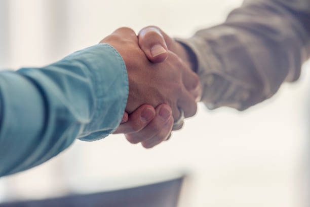 istock Close up of Two businessmen shaking hands. 1323936758