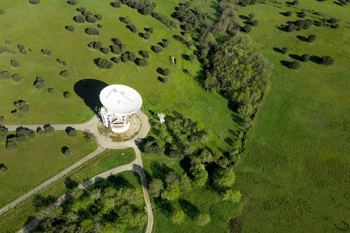 Aerial view of large telecommunications antenna or Radio telescope satellite dish. High quality photo.
