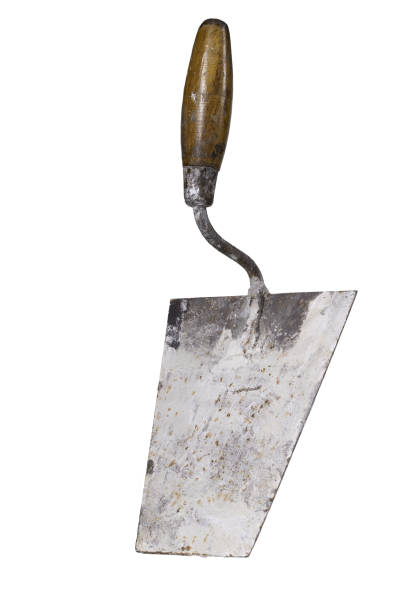 Trowel dirty with mortar. Accessories for construction workers. Light background.