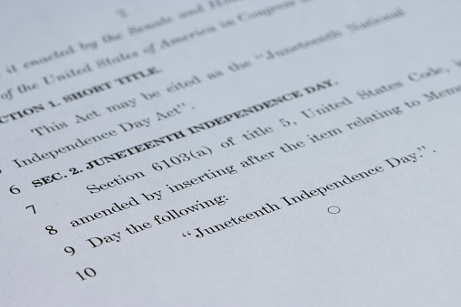 Closeup of the document of Juneteenth National Independence Day Act. The U.S. Senate passed a resolution on Tuesday, to recognize June 19 as an official holiday.