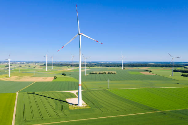 istock Wind Turbines in Spring Landscape, Aerial View 1323942528