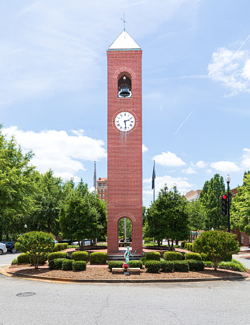Spartanburg, SC, USA-13 June 2021: The Old Town Clock was first installed in January, 1881, just months after the city was chartered.  Vertical image.