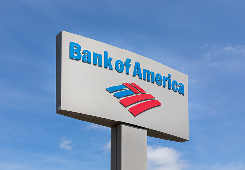 Spartanburg, SC, USA-13 June 2021:  A Bank of America sign and logo against a blue sky.   Horizontal image.