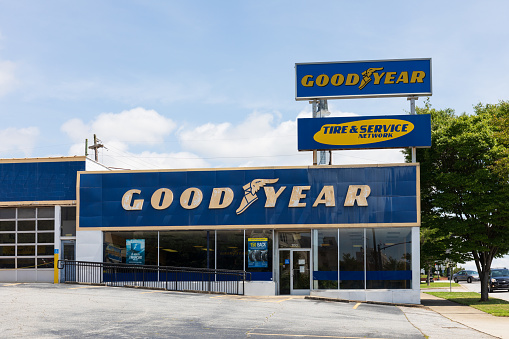 Spartanburg, SC, USA-13 June 2021: A Goodyear Tire & Service business building, shows display room exterior, and large signs. Horizontal image.