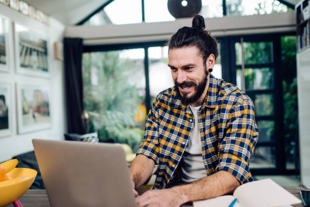 istock Portrait of a handsome man working from his home office 1323946526
