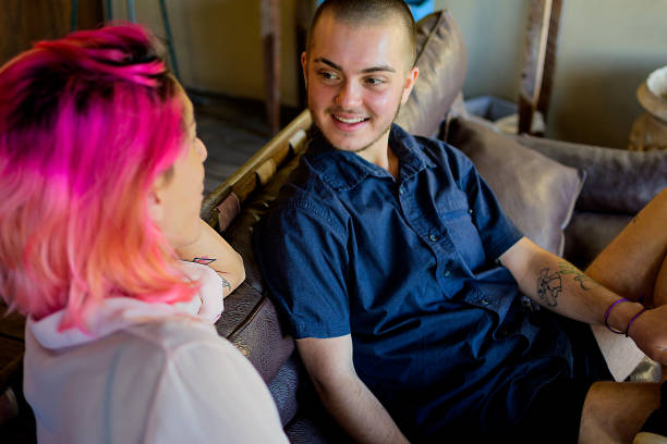 istock Transgender couple talking at the hotel reception 1323961942