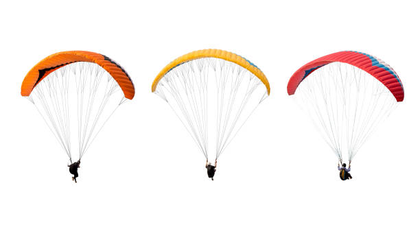 collezione paracadute colorato luminoso isolato su sfondo bianco, lo sportivo che vola su un parapendio. - parachuting foto e immagini stock
