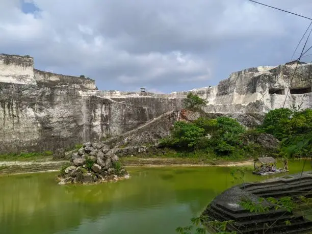 Photo of White brick quarry area & popular backdrop for taking pictures with limestone cliffs & boat rides in the pond.