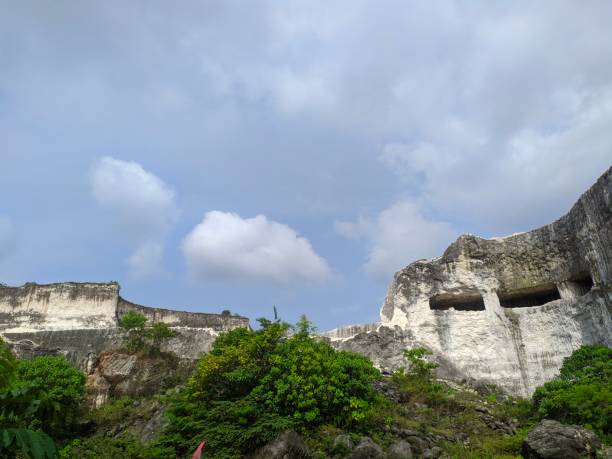 istock White brick quarry area & popular backdrop for taking pictures with limestone cliffs & boat rides in the pond. 1323973672