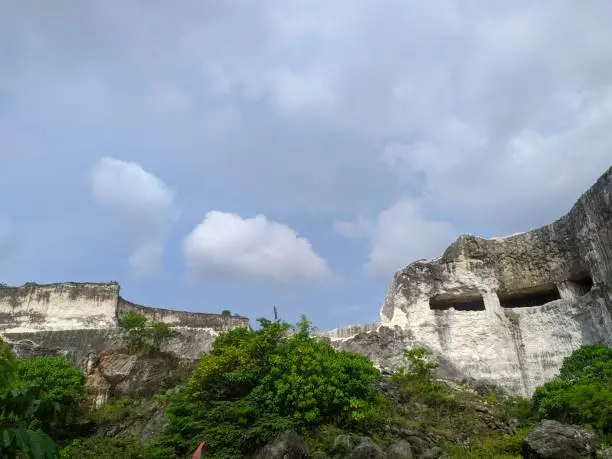 Photo of White brick quarry area & popular backdrop for taking pictures with limestone cliffs & boat rides in the pond.