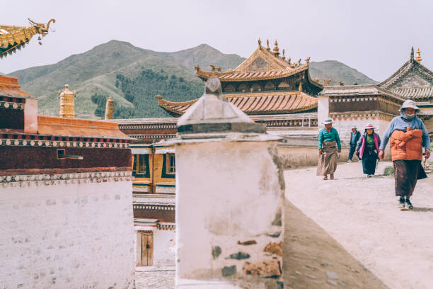 Xiahe, Tibet - June 1st 2021: Tibetan Buddhists praying and walking at Labrang monastery. Labrang monastery is one of the most important and largest monasteries to Tibetan Buddhism. Labrang monastery is free and open to public.
