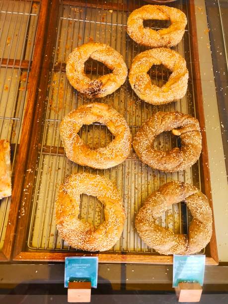 Fresh warm baked bagels on the bakery shop counter