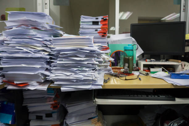 istock Busy, messy and cluttered workplace, full of documents 1323977742