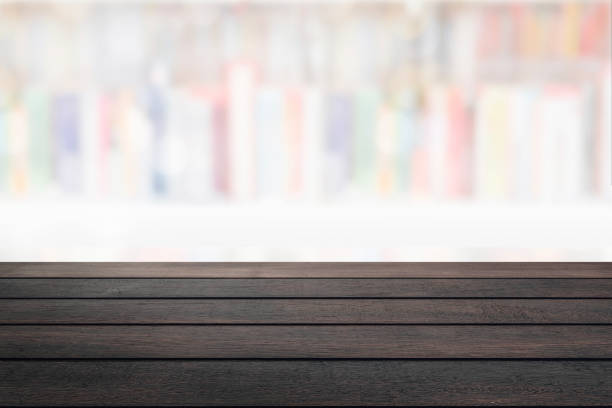 istock Empty wood table with abstract blur interior room background. 1323982717