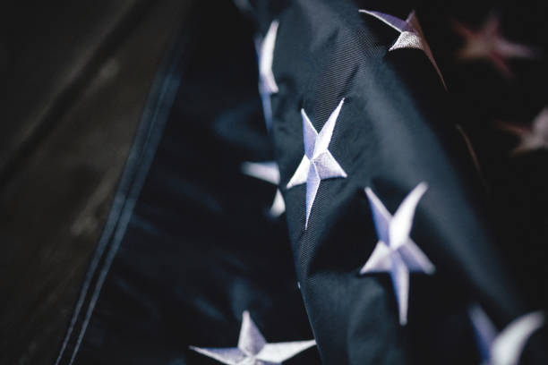 istock USA Flag on dark wooden background 1323983209