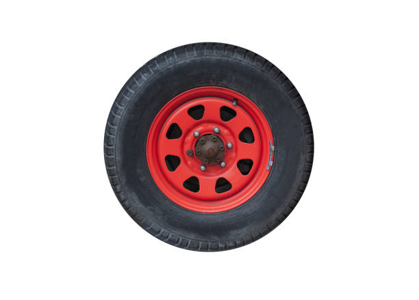 istock Car wheel on a red steel disc isolated on white 1323986020