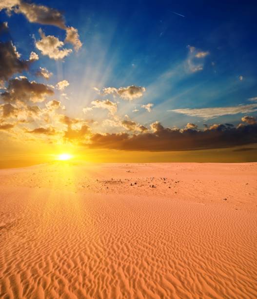 istock majestic sunset in a sand desert 1323988098