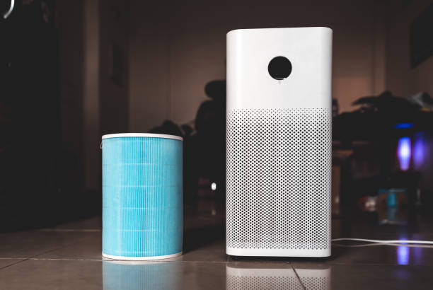 istock New filter for replacement in Air purifier, Changing HEPA filter. 1323988160