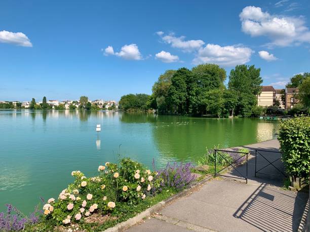 istock A beautiful public path next to the lake. 1323992421