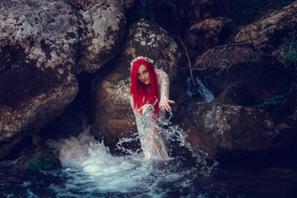 istock Beautiful young girl resting in water 1323993310