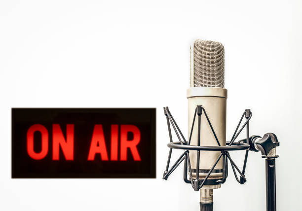 istock Professional microphone and on air sign 1323993409