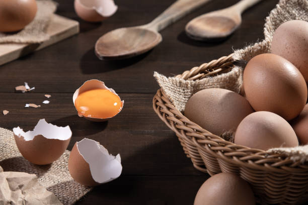 istock Chicken eggs on wooden background. Farm products, natural eggs. 1323993576