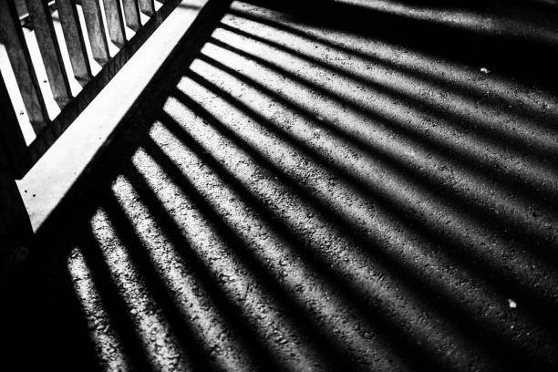istock Line shadow of a fence 1323993908