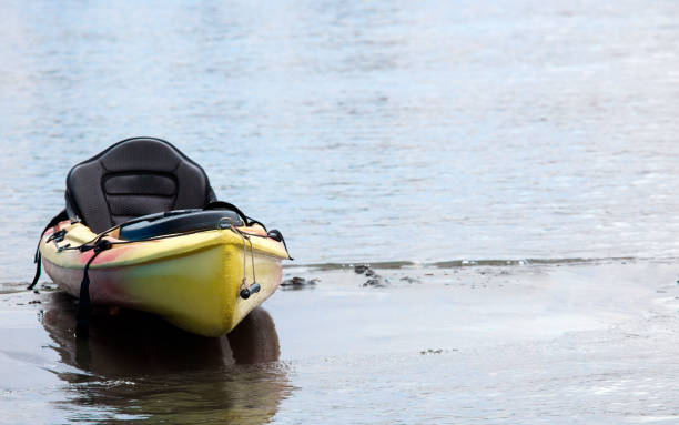 istock canoe on the beach at sunset, space for text 1324003179