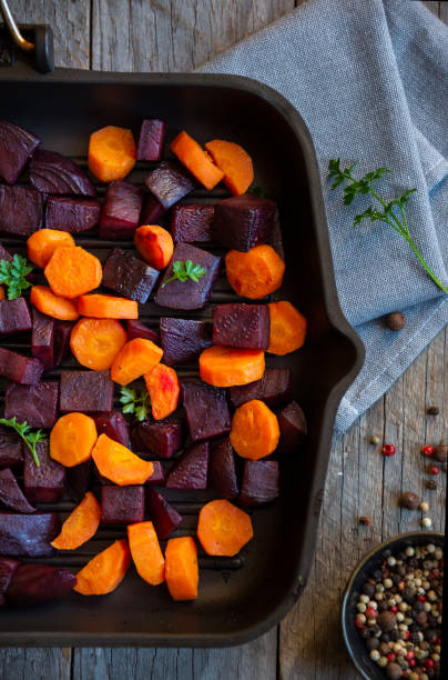 istock Cooked beets and carrots, healthy vegetarian dish 1324006633