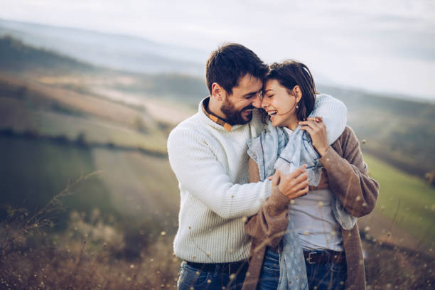 istock Young happy couple embracing with great affection in nature. 1324007517
