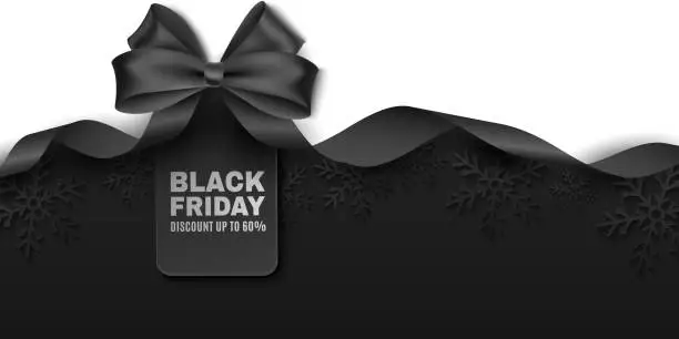 Vector illustration of Black bow and ribbon with tag for Black Friday sale. Vector label to advertise your business promotions. Commercial discount event. Paper snowflakes on a dark background.