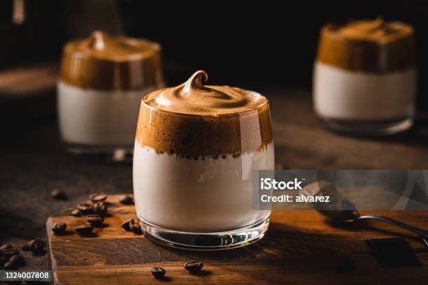 Dalgona Coffee With Coffee Beans On Table Stock Photo - Download Image Now - Coffee - Drink, Dessert - Sweet Food, Cafe