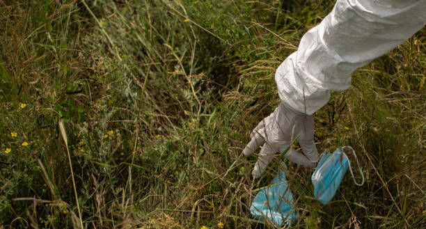 istock Man cleaning the environment, collecting trash, ecology concept, volunteer, plastic, recycle, save the planet, keep the planet clean. 1324010179