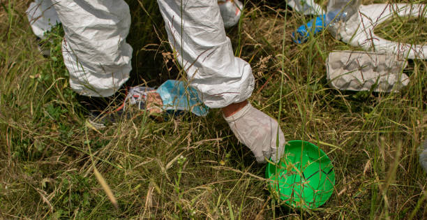 istock Man cleaning the environment, collecting trash, ecology concept, volunteer, plastic, recycle, save the planet, keep the planet clean. 1324010736