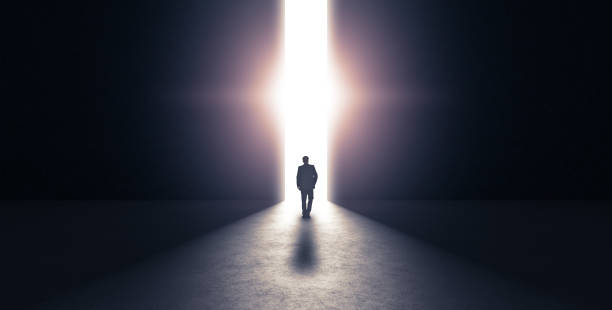 Man walking towards light concept. 3d rendering Man walking towards light concept. 3d rendering door stock pictures, royalty-free photos & images