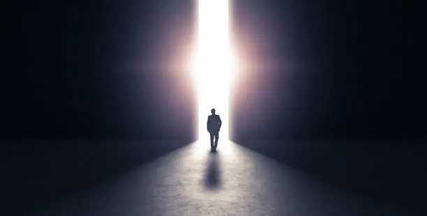Photo of Man walking towards light concept. 3d rendering