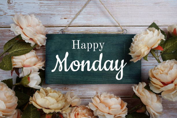 istock Happy Monday typography text with flower decoration on wooden background 1324010969