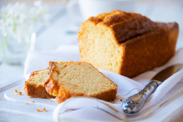 Sweet loaf or fruit cake with apricots Sweet bread or fruit cake on white fruitcake stock pictures, royalty-free photos & images