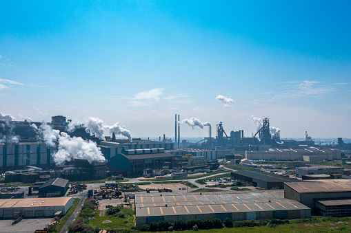 Drone shot of a steel mill in the early morning. Blast furnace and coal depot