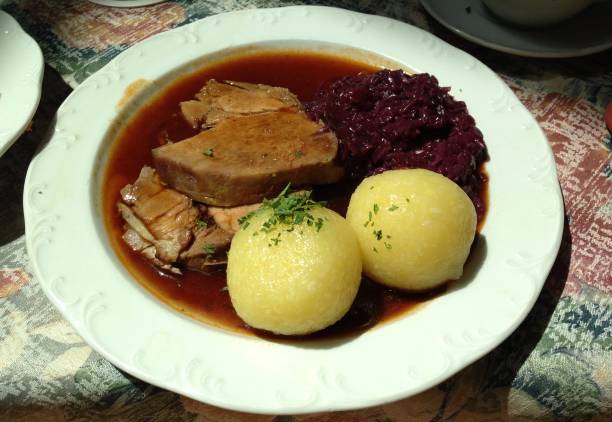 istock Sauerbraten with Red Cabbage and Dumplings 1324013957