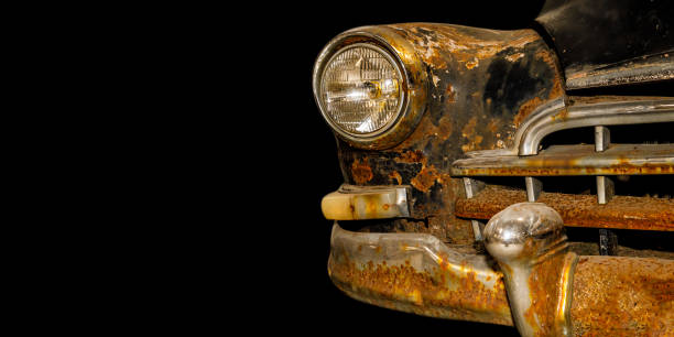istock vintage rusty car isolated on black background 1324015174
