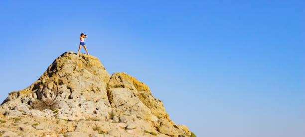 istock Woman with camera take travel photo 1324016192