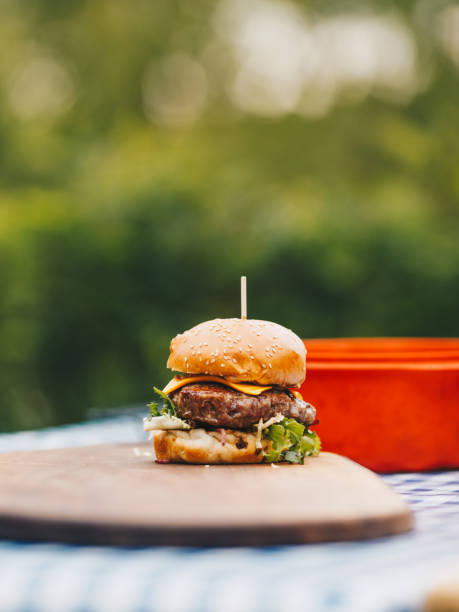 istock Tasty hamburger on chopping board. 1324016373