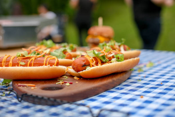 istock Fresh hot dogs on wooden board. 1324018184