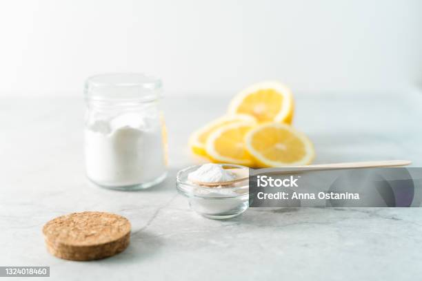 Eco Friendly Natural Cleaners Jar With Baking Soda Lemon And Wooden Spoon On Marble Table Background Organic Ingredients For Homemade Cleaning Zero Waste Concept Stock Photo - Download Image Now