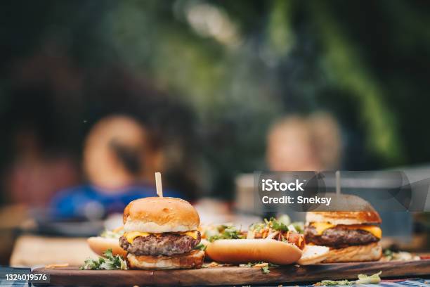 Dinner Is Served Stock Photo - Download Image Now - Burger, Barbecue - Meal, Grilled