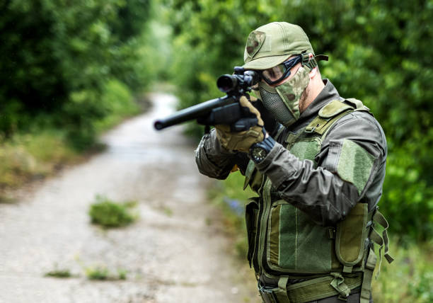 istock Army soldier with sniper rifle 1324020896