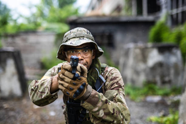 istock Soldier with handgun centers towards the camera 1324021064