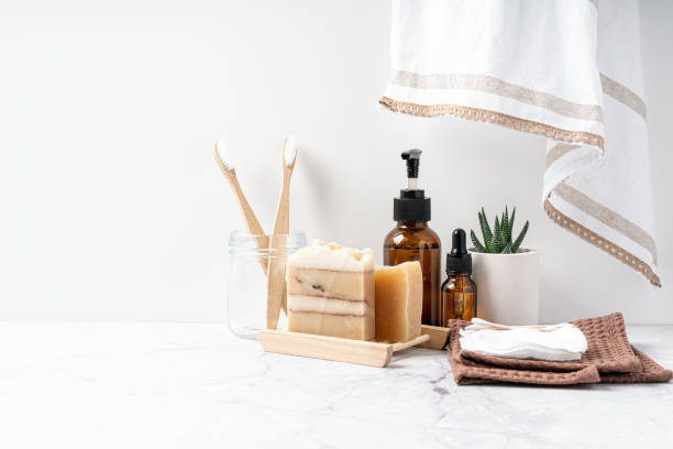 istock Natural bathroom and home spa tools. Zero waste sustainable lifestyle concept. Bamboo toothbrush, natural soap bar, cotton pads, homemade DIY beauty products in reusable bottles on white background 1324021145